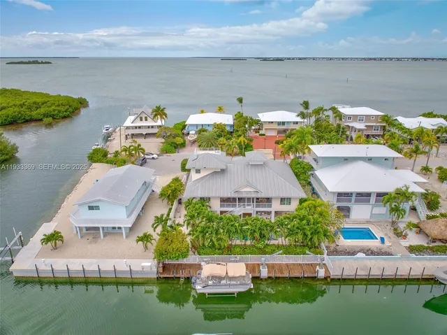 a aerial view of a house with a yard and garden