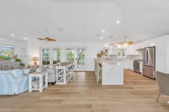 a living room with lots of furniture and white walls