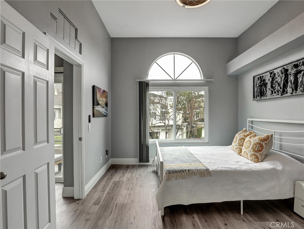 25081 Leucadia Street, Unit F Laguna Niguel, CA 92677 - Photo 12 of 30 a bedroom with a bed and a window