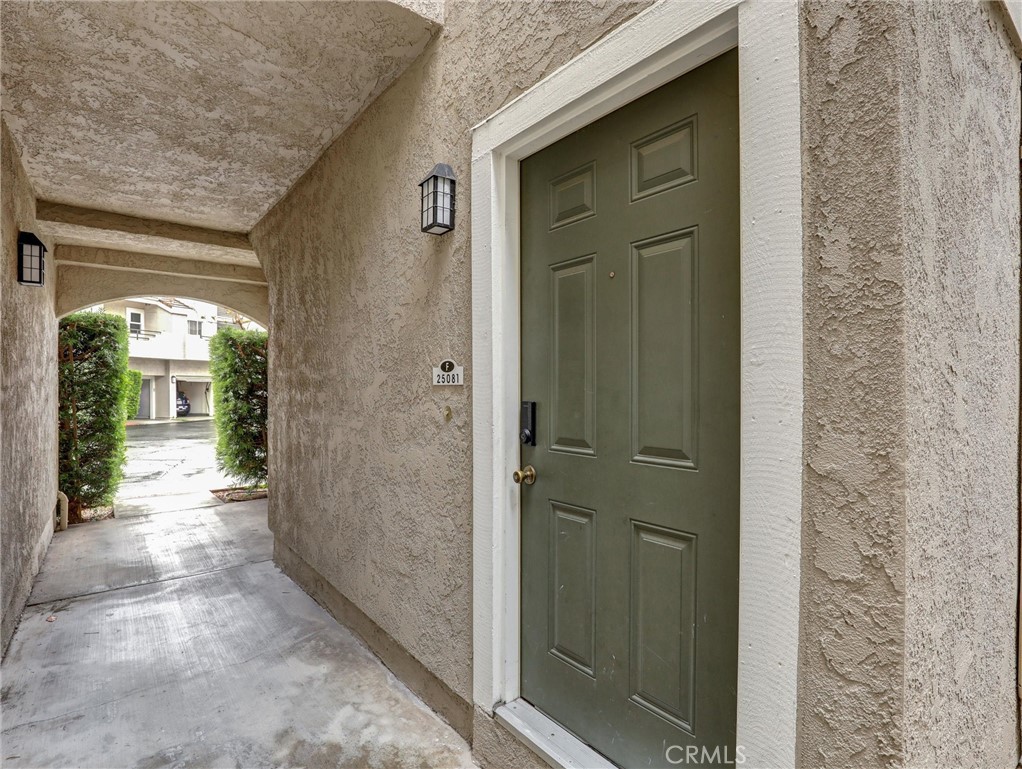 25081 Leucadia Street, Unit F Laguna Niguel, CA 92677 - Photo 24 of 30 a view of a brick house with a glass door