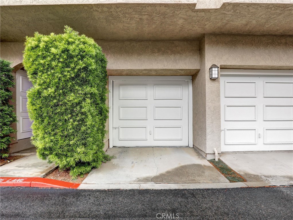 25081 Leucadia Street, Unit F Laguna Niguel, CA 92677 - Photo 25 of 30 a view of house with garage