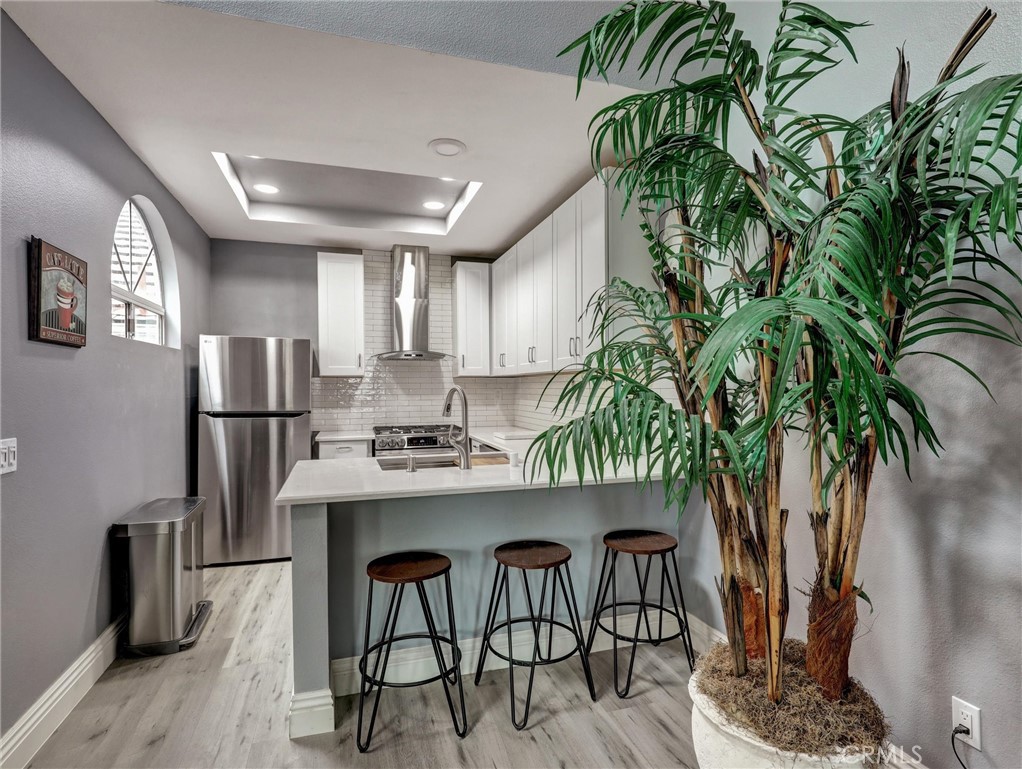 25081 Leucadia Street, Unit F Laguna Niguel, CA 92677 - Photo 7 of 30 a kitchen with counter top space and appliances