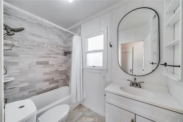 a bathroom with a sink a toilet and a bathtub