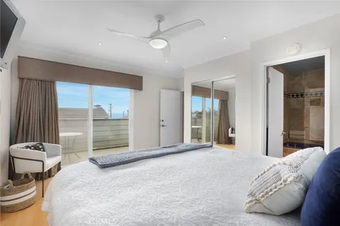 a bedroom with a bed and a chair