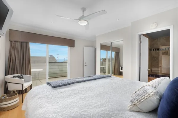 a bedroom with a bed and a chair