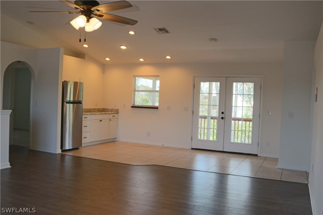 18425 Iris Road Fort Myers, FL 33967 - Photo 12 of 27 a view of an empty room with a window and wooden floor
