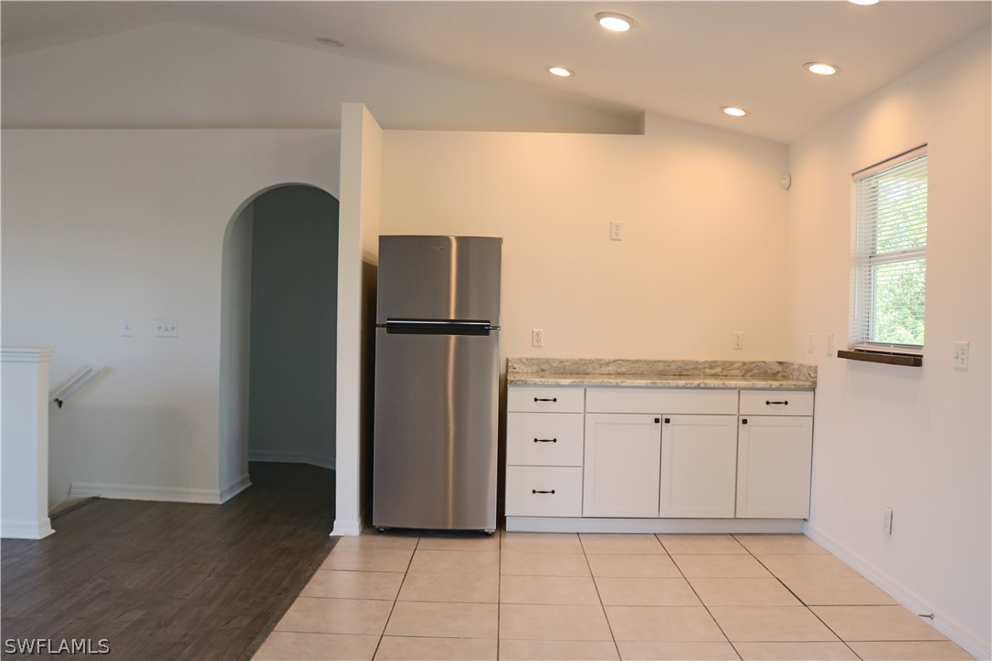 18425 Iris Road Fort Myers, FL 33967 - Photo 13 of 27 a view of a kitchen with refrigerator and wooden floor