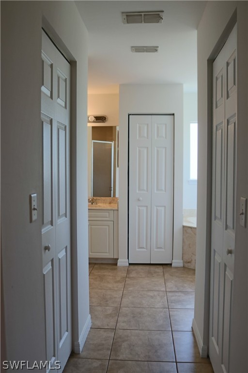 18425 Iris Road Fort Myers, FL 33967 - Photo 17 of 27 a view of a hallway with closet and livingroom