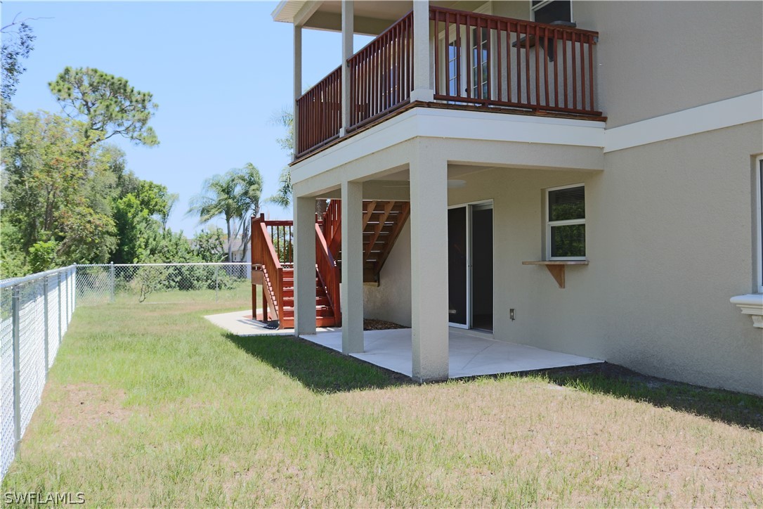 18425 Iris Road Fort Myers, FL 33967 - Photo 23 of 27 a view of a house with pool and a yard