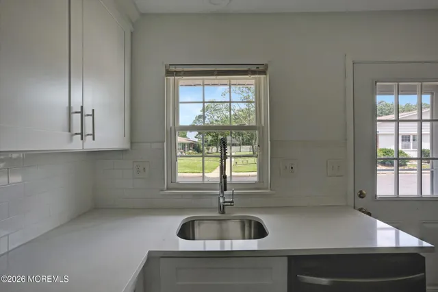 a kitchen with a sink and a window