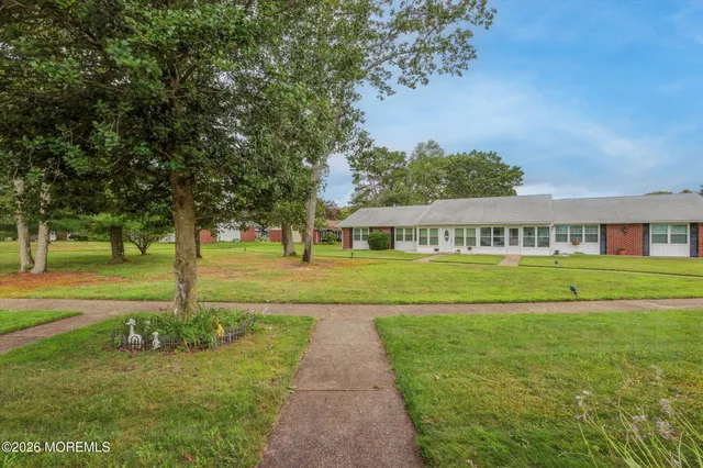 a view of green field with trees