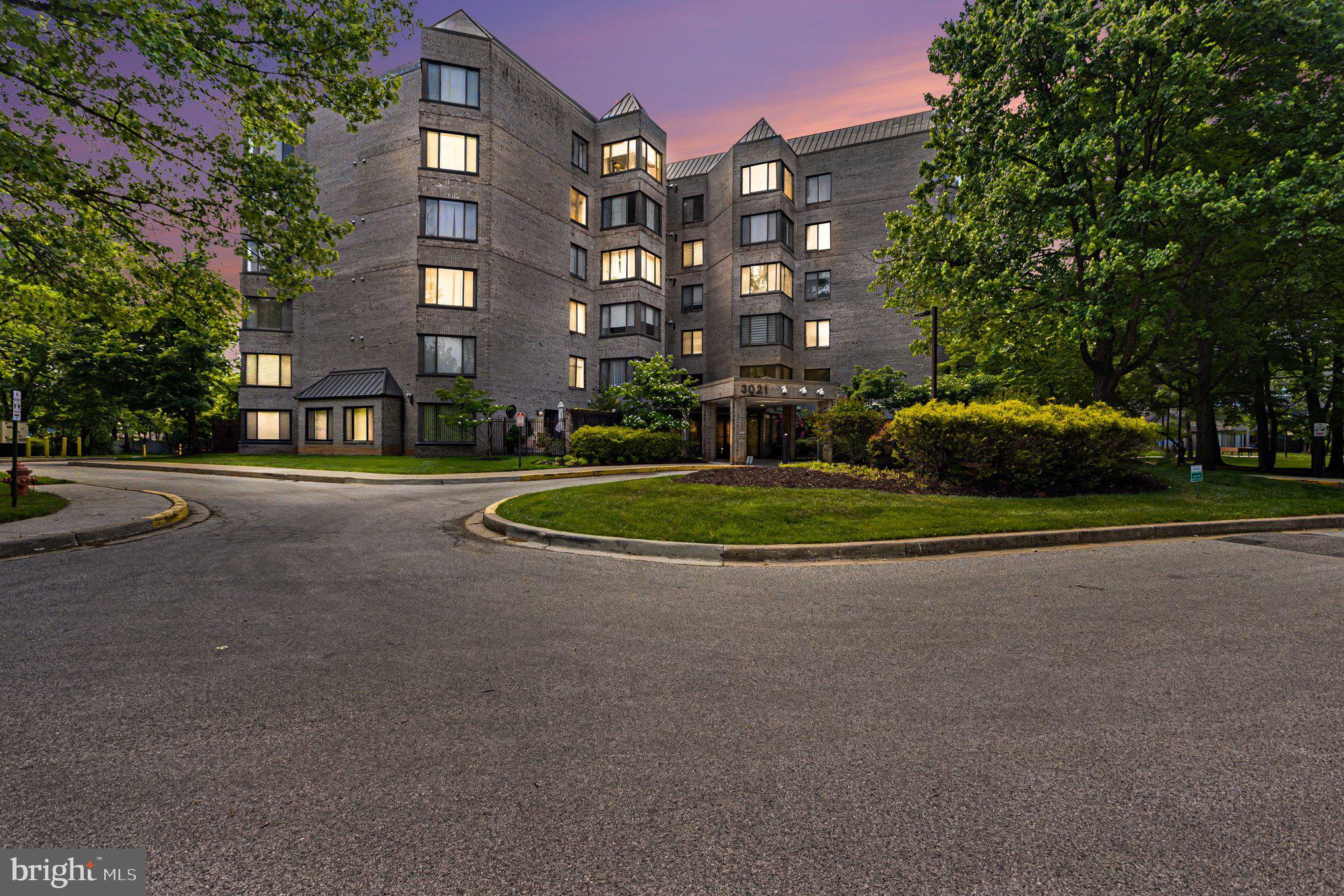 3021 Fallstaff Road, Unit 208B Baltimore, MD 21209 - Photo 2 of 25 a front view of a building with cars parked