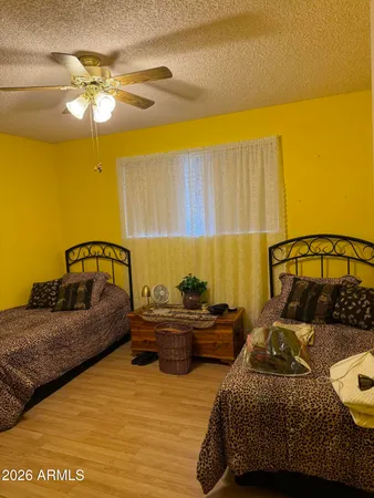 a bedroom with bed and window