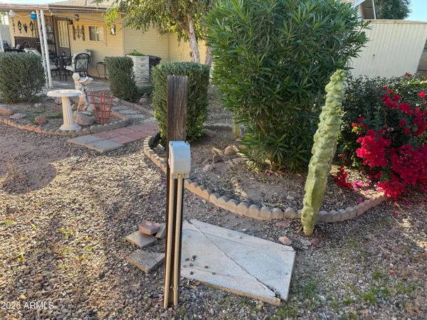 a view of a house with a yard and tree s