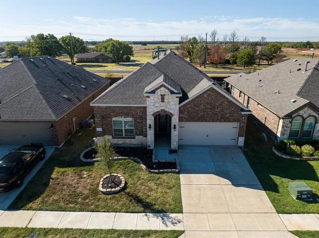 an aerial view of a house with garden