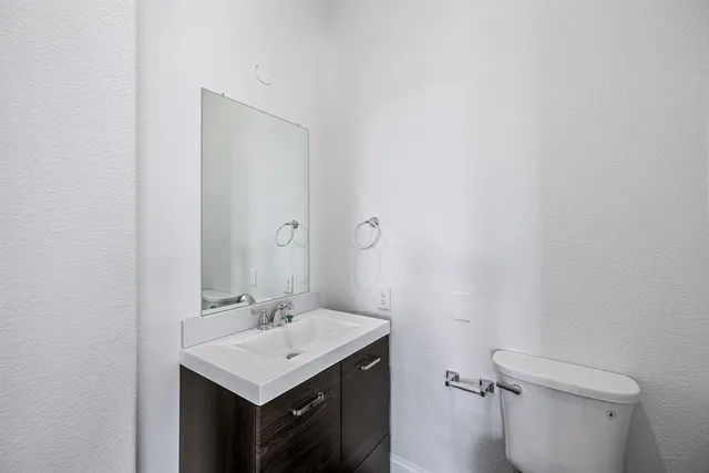 a kitchen with granite countertop kitchen island stainless steel appliances a sink stove and microwave