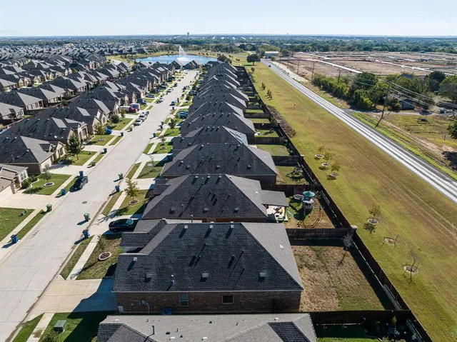an aerial view of a house with a swimming pool
