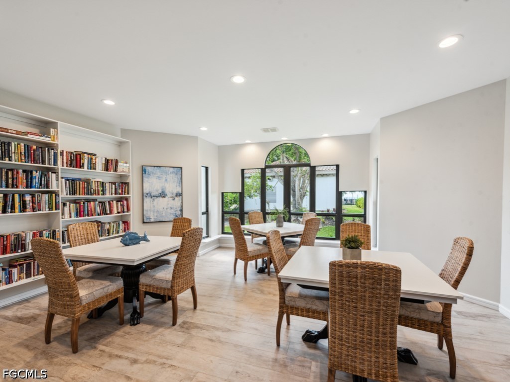 232 La Peninsula Boulevard, Unit 232 Naples, FL 34113 - Photo 42 of 44 a living room with furniture and a large window
