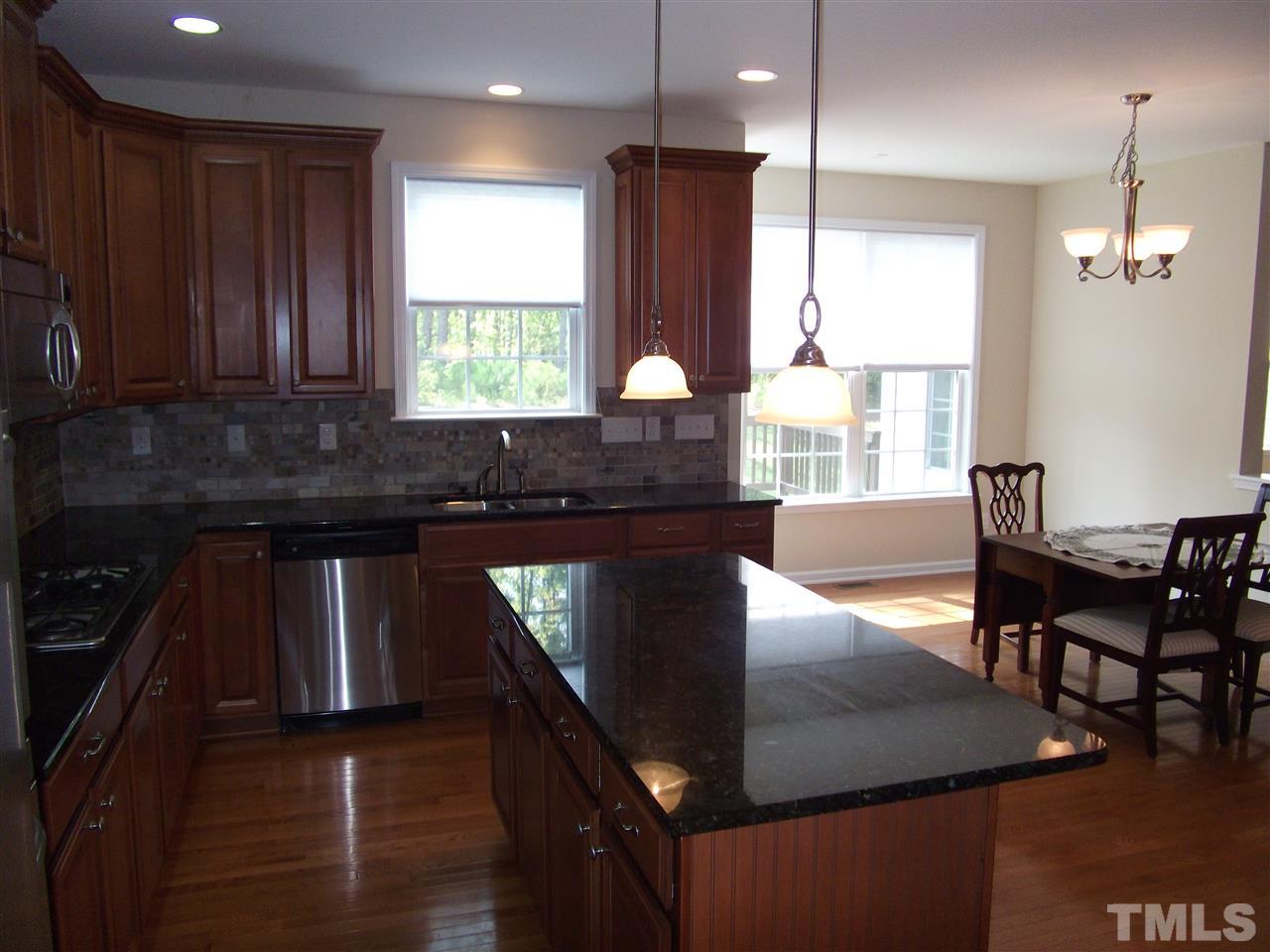 2993 Rolling Hill Road Durham, NC 27705 - Photo 13 of 25 Granite counter tops in kitchen.