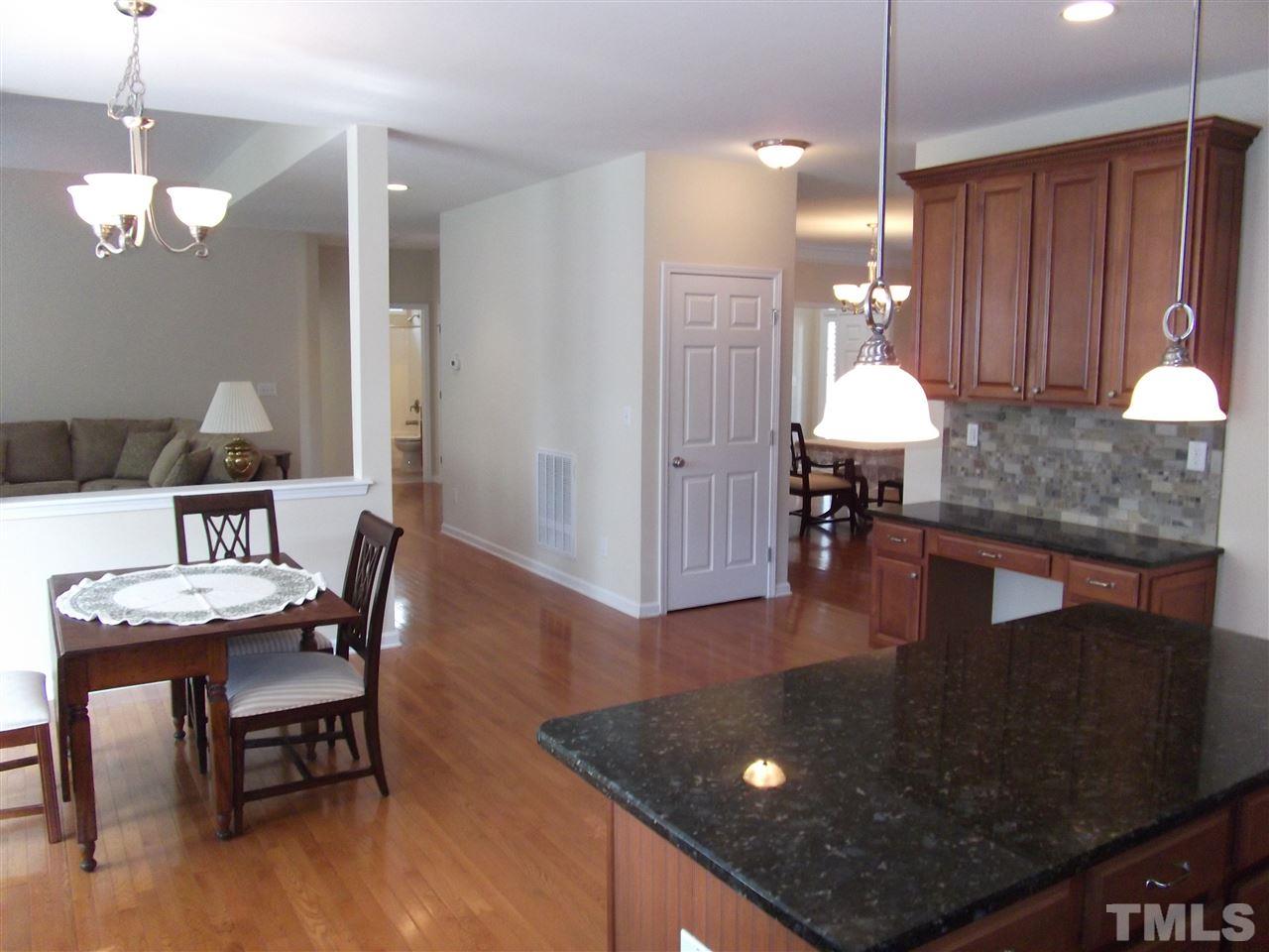 2993 Rolling Hill Road Durham, NC 27705 - Photo 14 of 25 Kitchen offers stainless steel appliances, granite counters and stone veneer back splash.