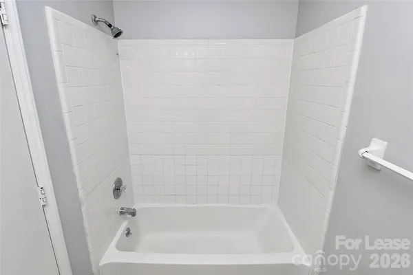 a close up of a bathtub curtain