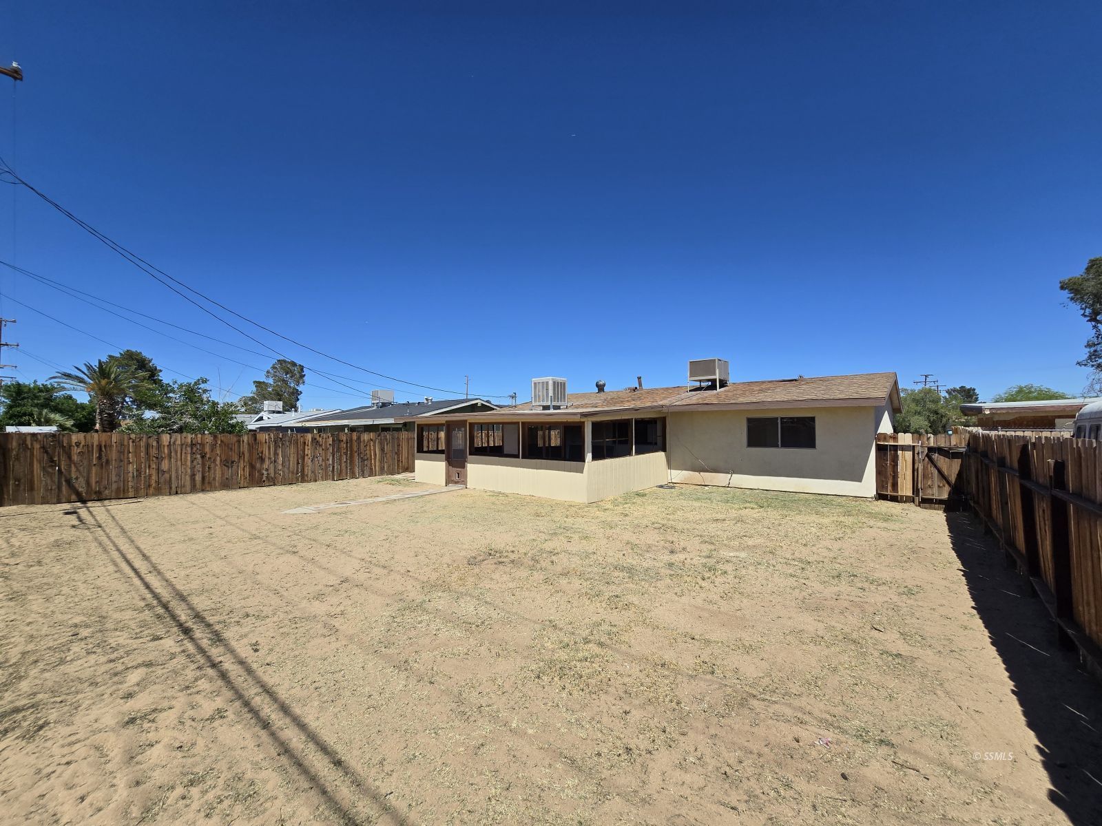 321 Lenore Street Ridgecrest, CA 93555 - Photo 19 of 20 a view of a swimming pool with a yard