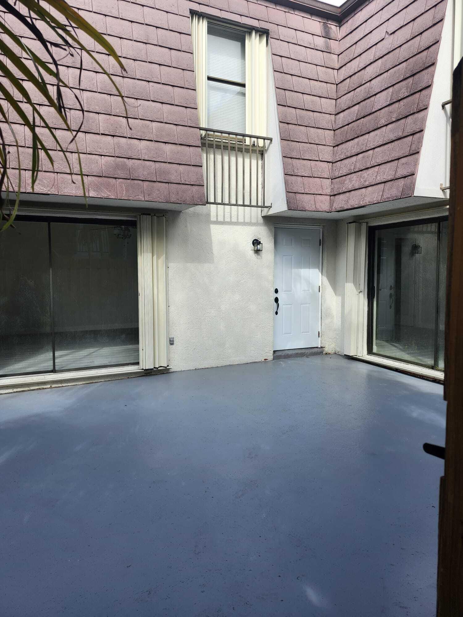 7519 Courtyard Run East Boca Raton, FL 33433 - Photo 18 of 29 a view of a house with a garage