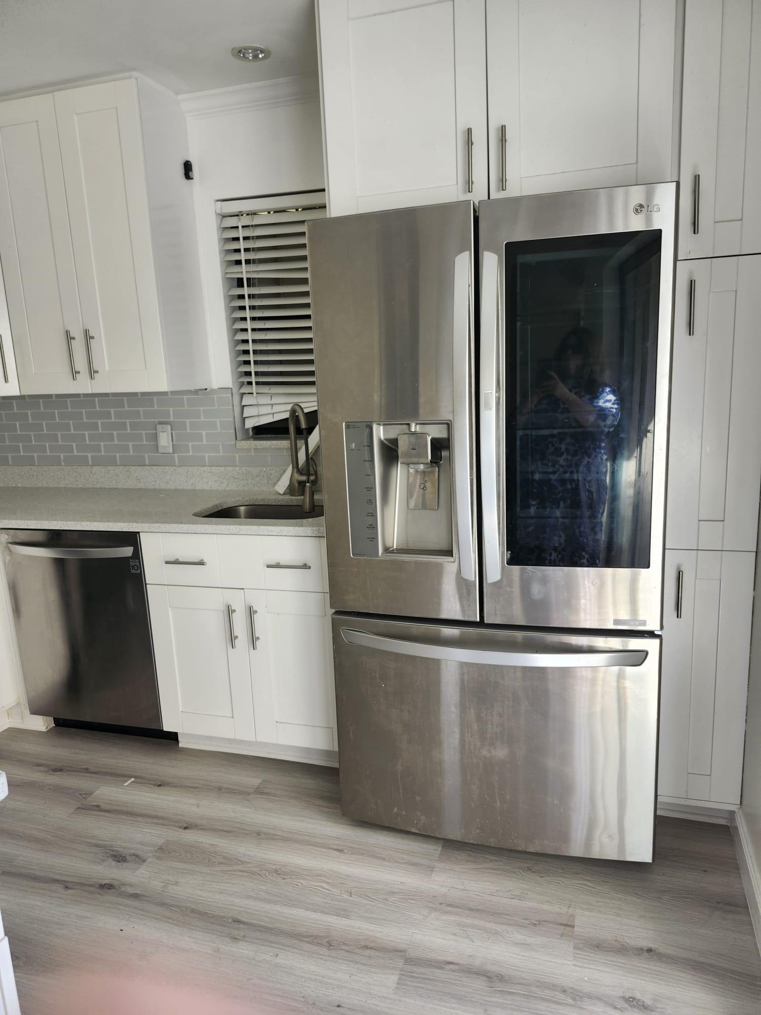 7519 Courtyard Run East Boca Raton, FL 33433 - Photo 3 of 29 a kitchen with granite countertop a refrigerator and a stove