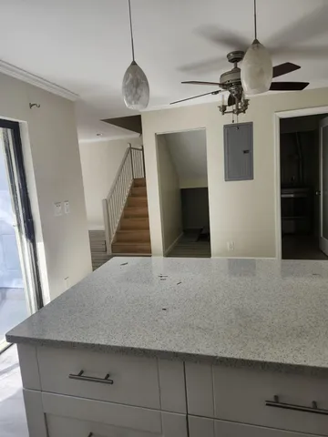 a living room with a table and chairs