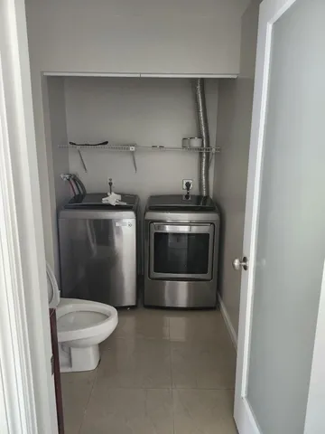 a stove top oven sitting inside of a kitchen