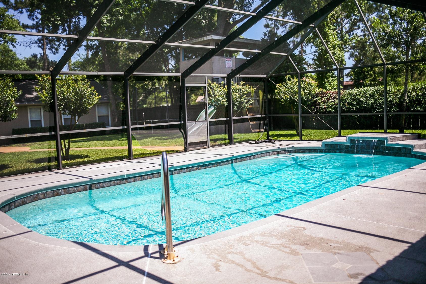 3967 Eunice Road Jacksonville, FL 32250 - Photo 18 of 28 a view of a backyard with swimming pool