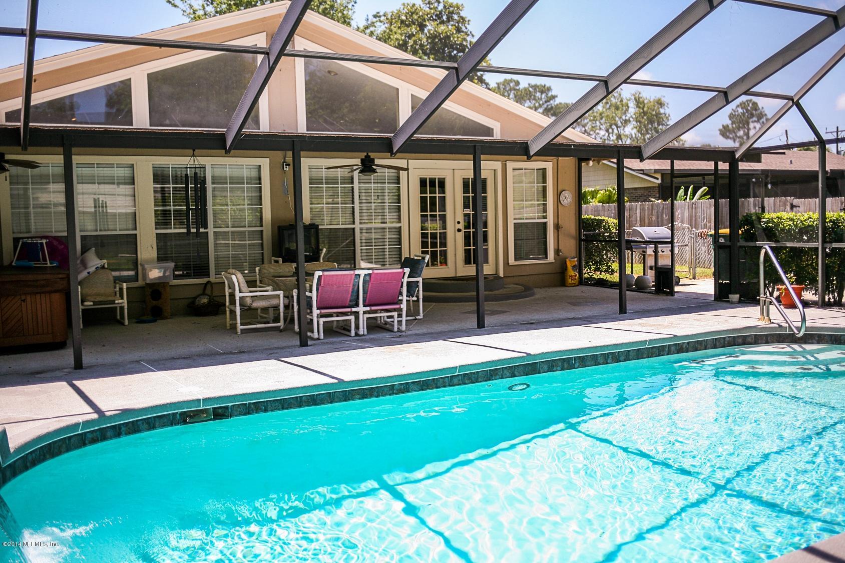 3967 Eunice Road Jacksonville, FL 32250 - Photo 19 of 28 a view of a house with swimming pool and sitting area