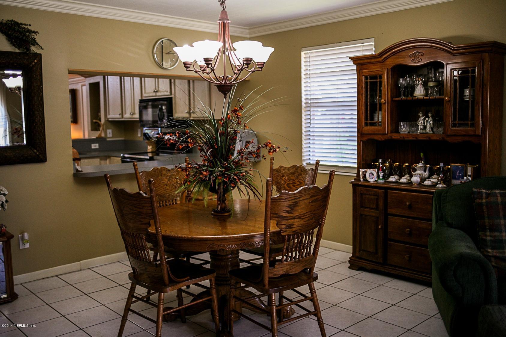 3967 Eunice Road Jacksonville, FL 32250 - Photo 3 of 28 a dining room with furniture and chandelier