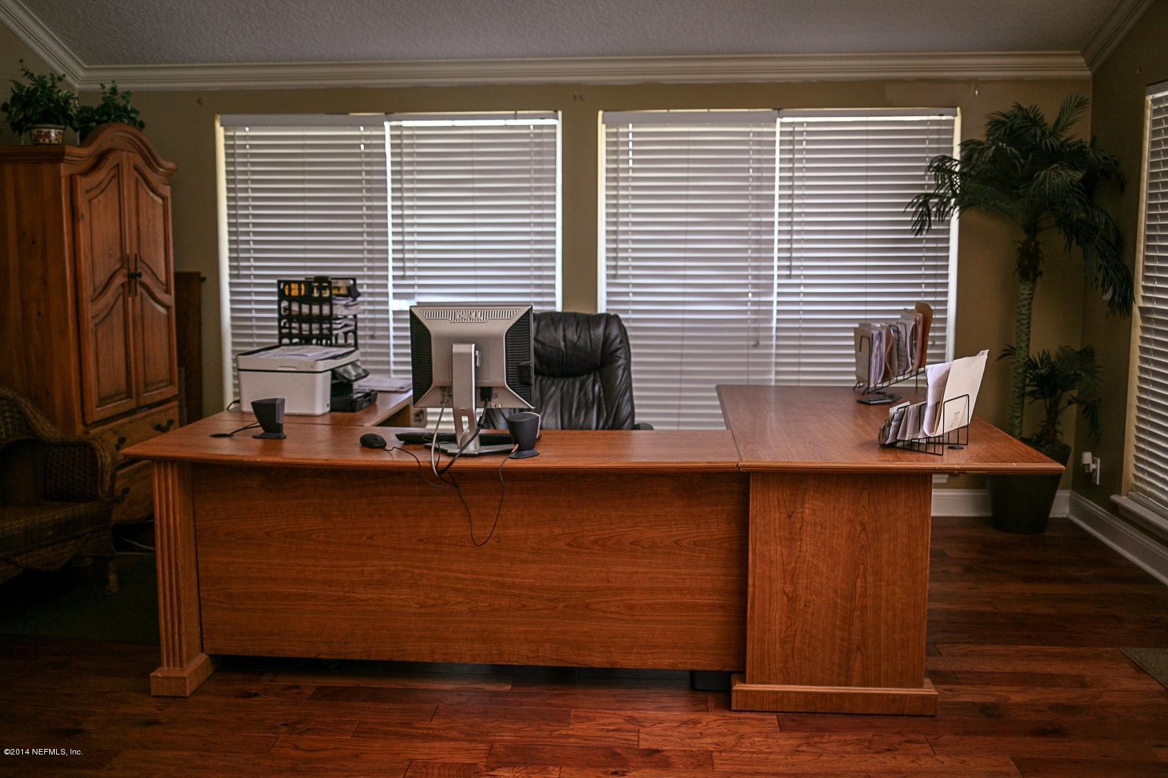 3967 Eunice Road Jacksonville, FL 32250 - Photo 10 of 28 a view of a workspace with furniture and a window