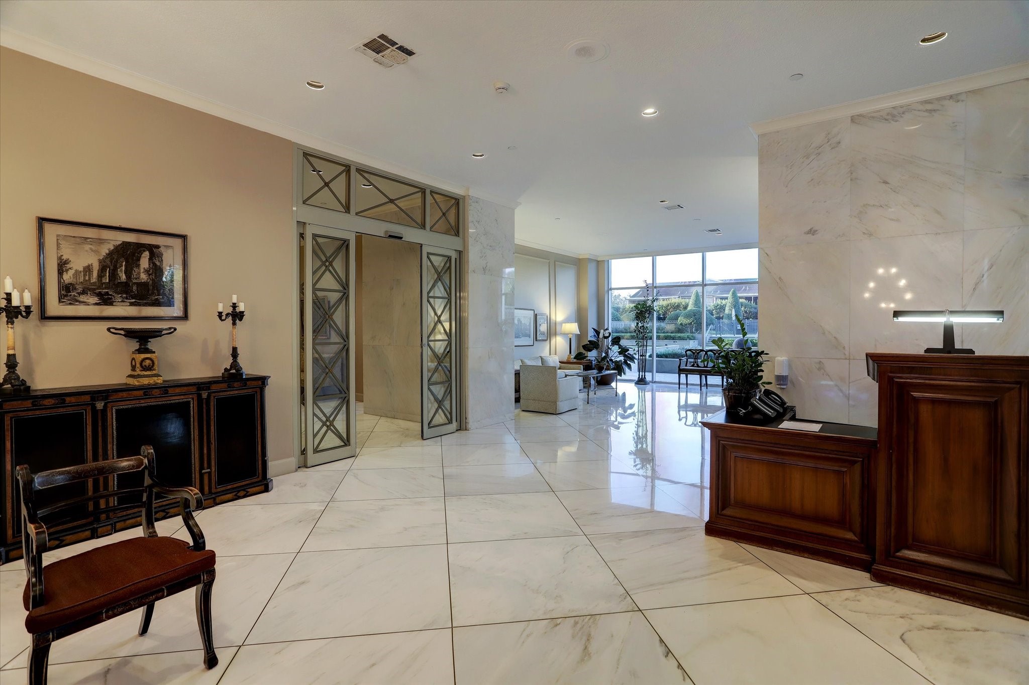 2200 Willowick Road, Unit 5C Houston, TX 77027 - Photo 20 of 27 Front desk and view to elevator vestibule. Full service building with door man. Attractive common areas throughout.