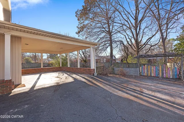 a view of backyard with green space