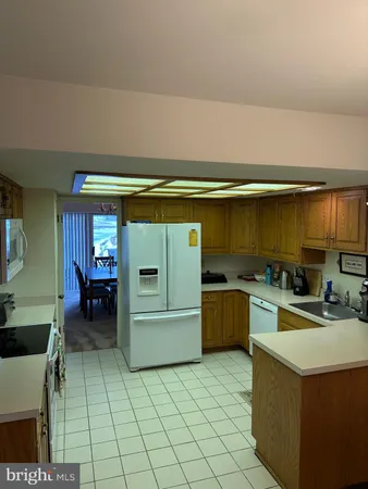 a kitchen with a cabinets and a stove top oven