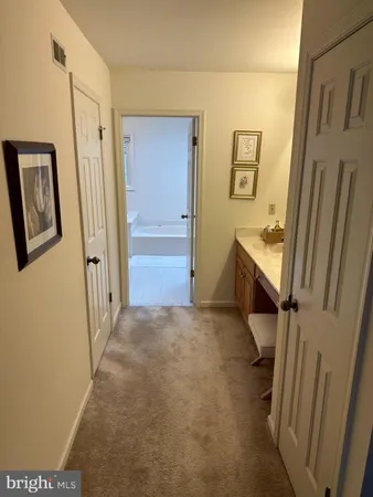 a view of a hallway with front door