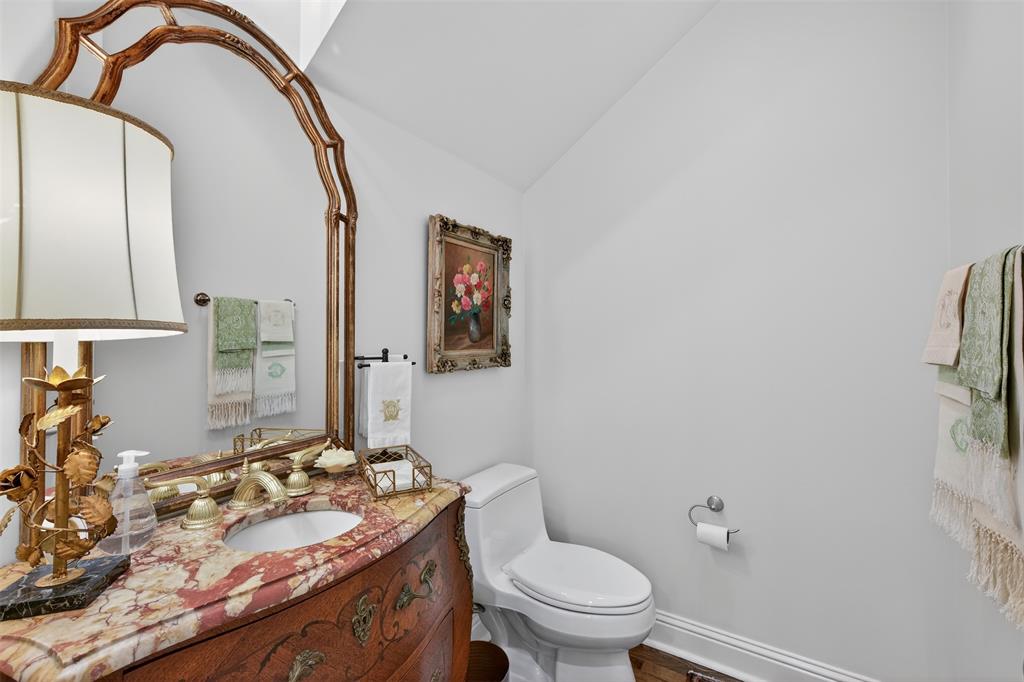 7717 Creswell Road, Unit 48 Shreveport, LA 71106 - Photo 31 of 37 a bathroom with a granite countertop sink mirror vanity and toilet