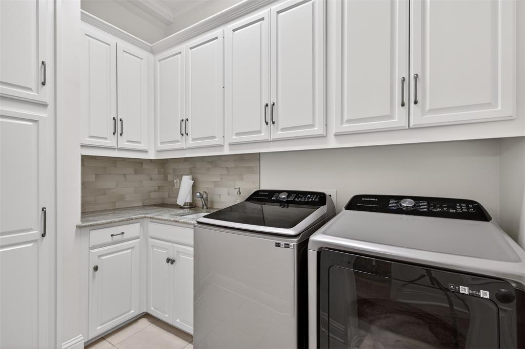 7717 Creswell Road, Unit 48 Shreveport, LA 71106 - Photo 32 of 37 a kitchen with granite countertop white cabinets and a stove top oven