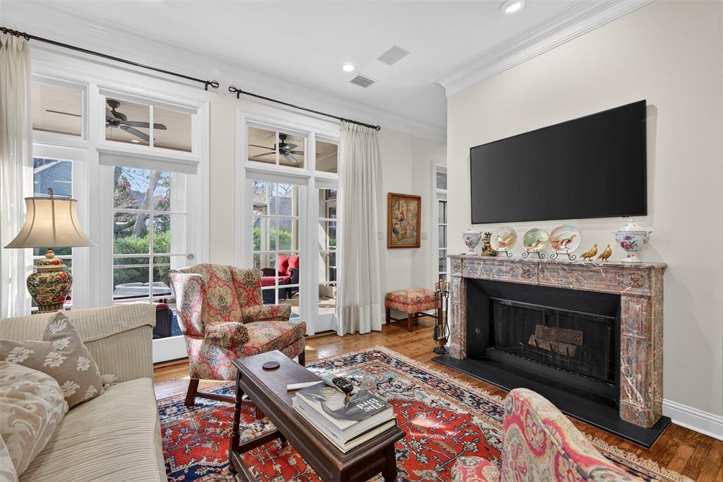 7717 Creswell Road, Unit 48 Shreveport, LA 71106 - Photo 4 of 37 a living room with furniture a flat screen tv and a fireplace