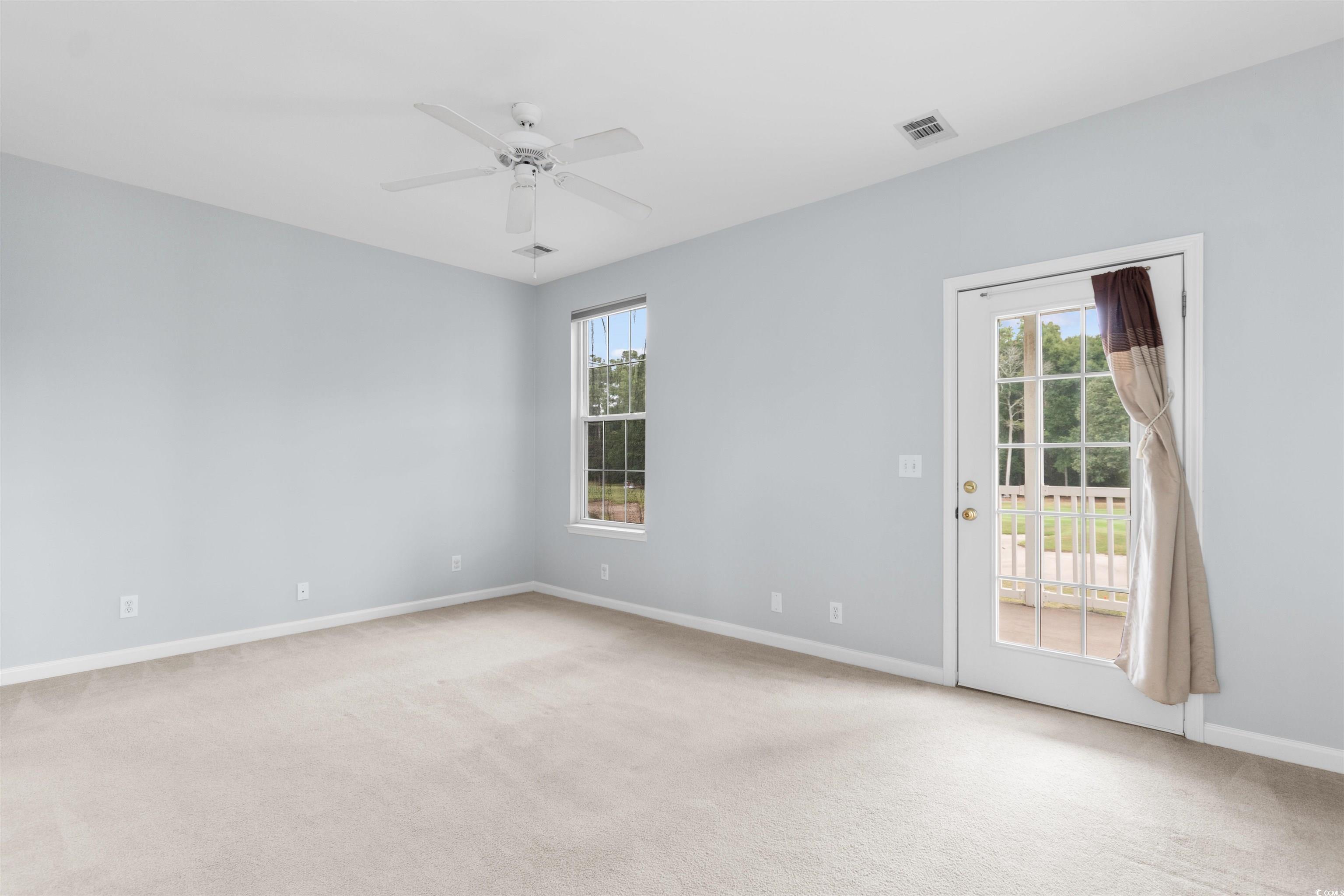 4430 Lady Banks Lane, Unit A2 Murrells Inlet, SC 29576 - Photo 18 of 31 Unfurnished room featuring light colored carpet and ceiling fan