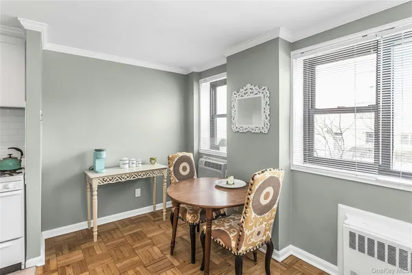 a view of a dining room with furniture and window