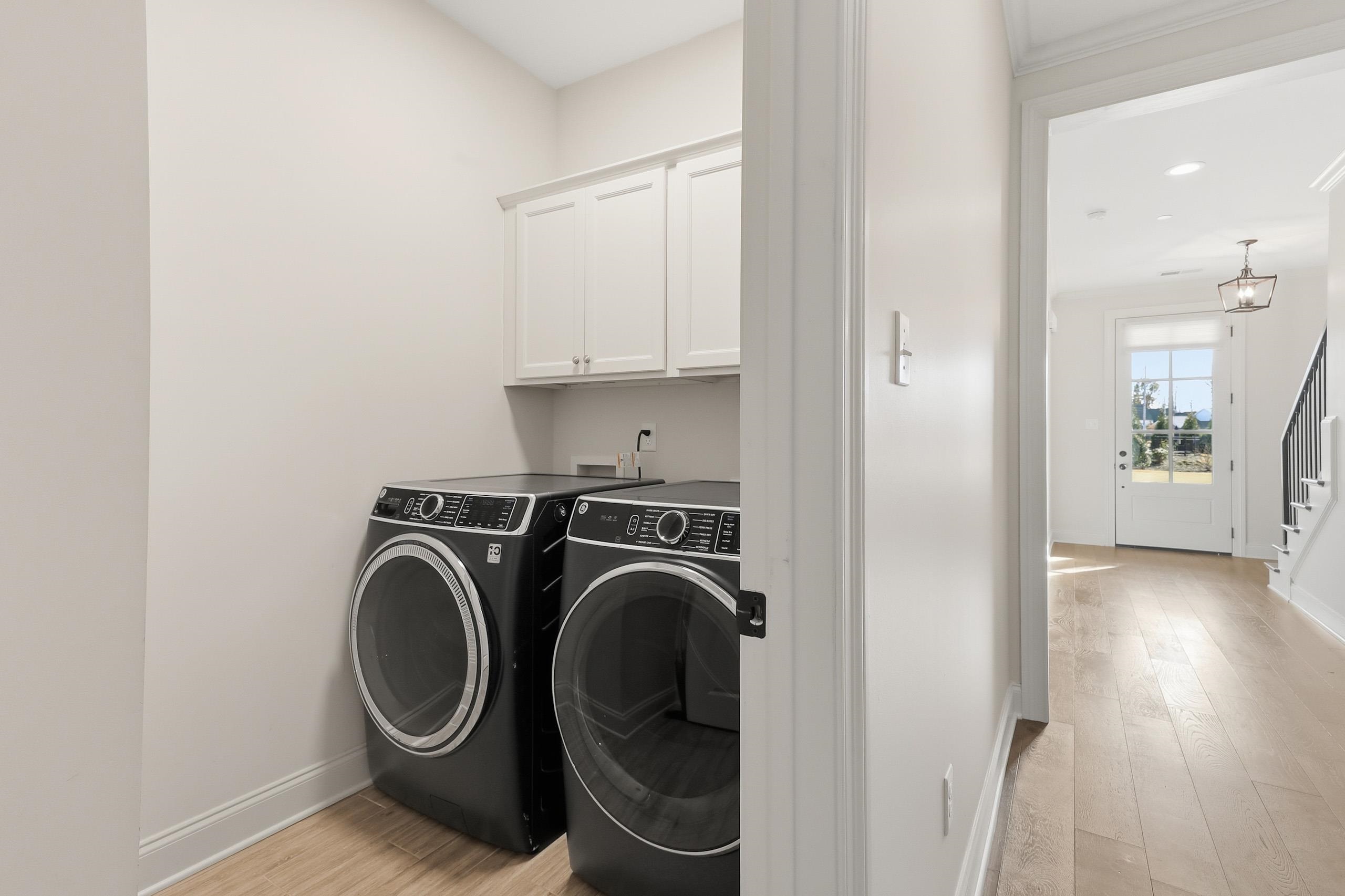 897 Ufton Alley Collierville, TN 38017 - Photo 17 of 32 a view of a hallway with washer and dryer