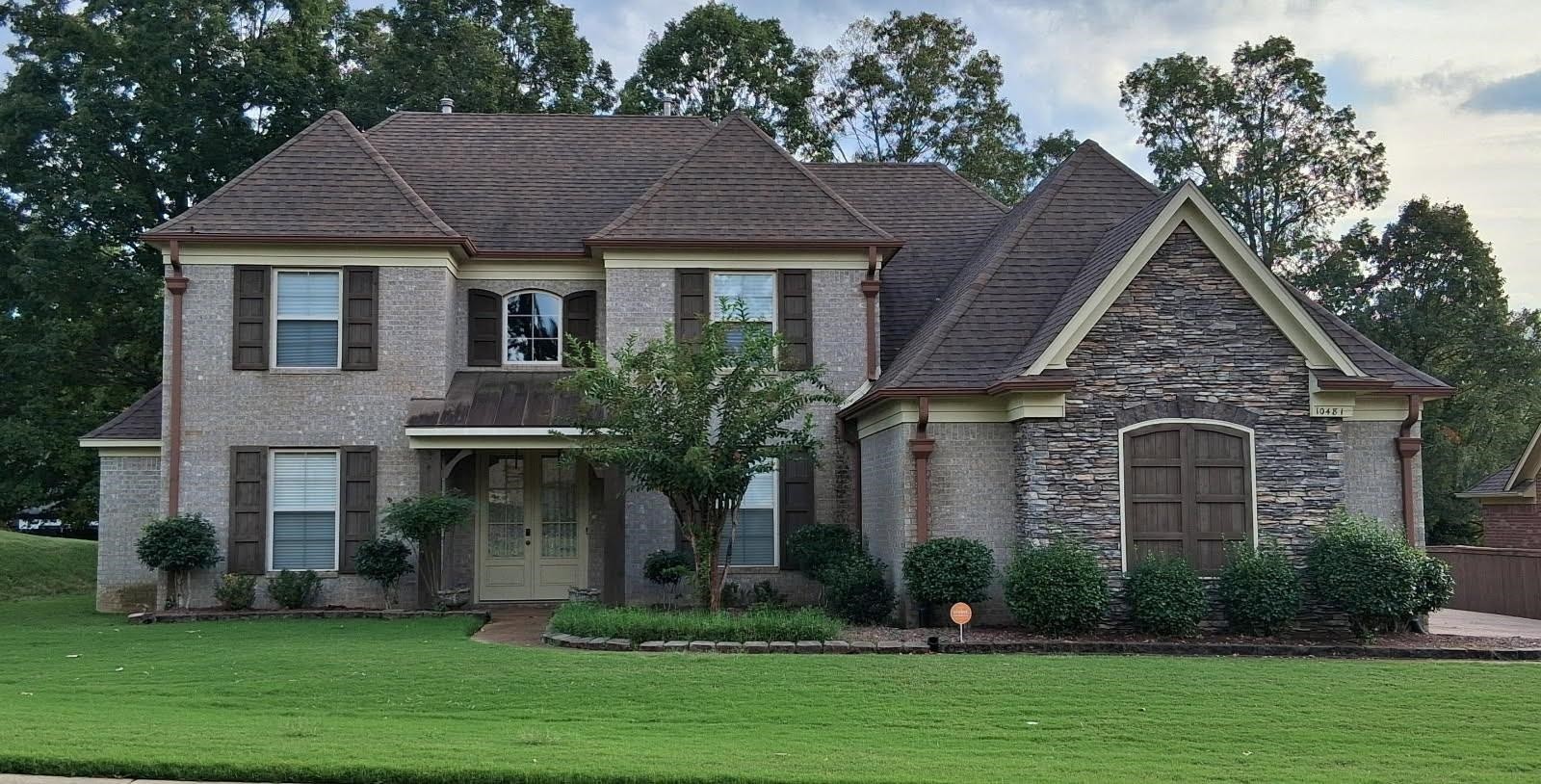 10481 Mabry Mill Road Cordova, TN 38016 - Photo 1 of 32 a front view of a house with a yard and trees