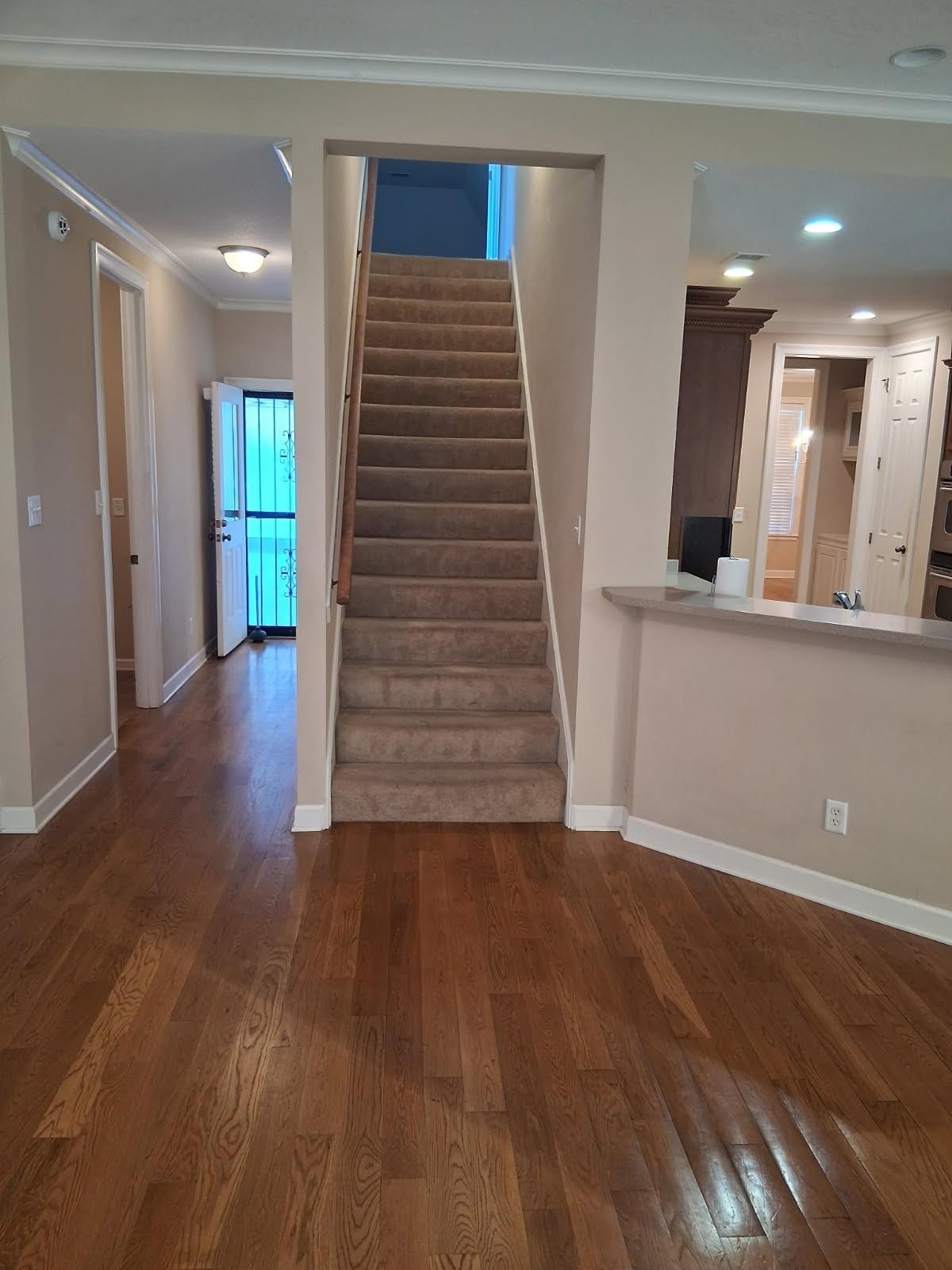 10481 Mabry Mill Road Cordova, TN 38016 - Photo 11 of 32 a view of a hallway with wooden floor and staircase