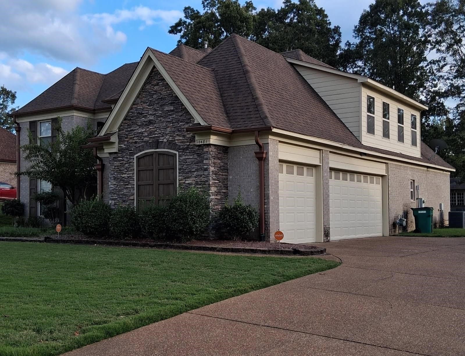 10481 Mabry Mill Road Cordova, TN 38016 - Photo 2 of 32 a front view of a house with a garden and plants