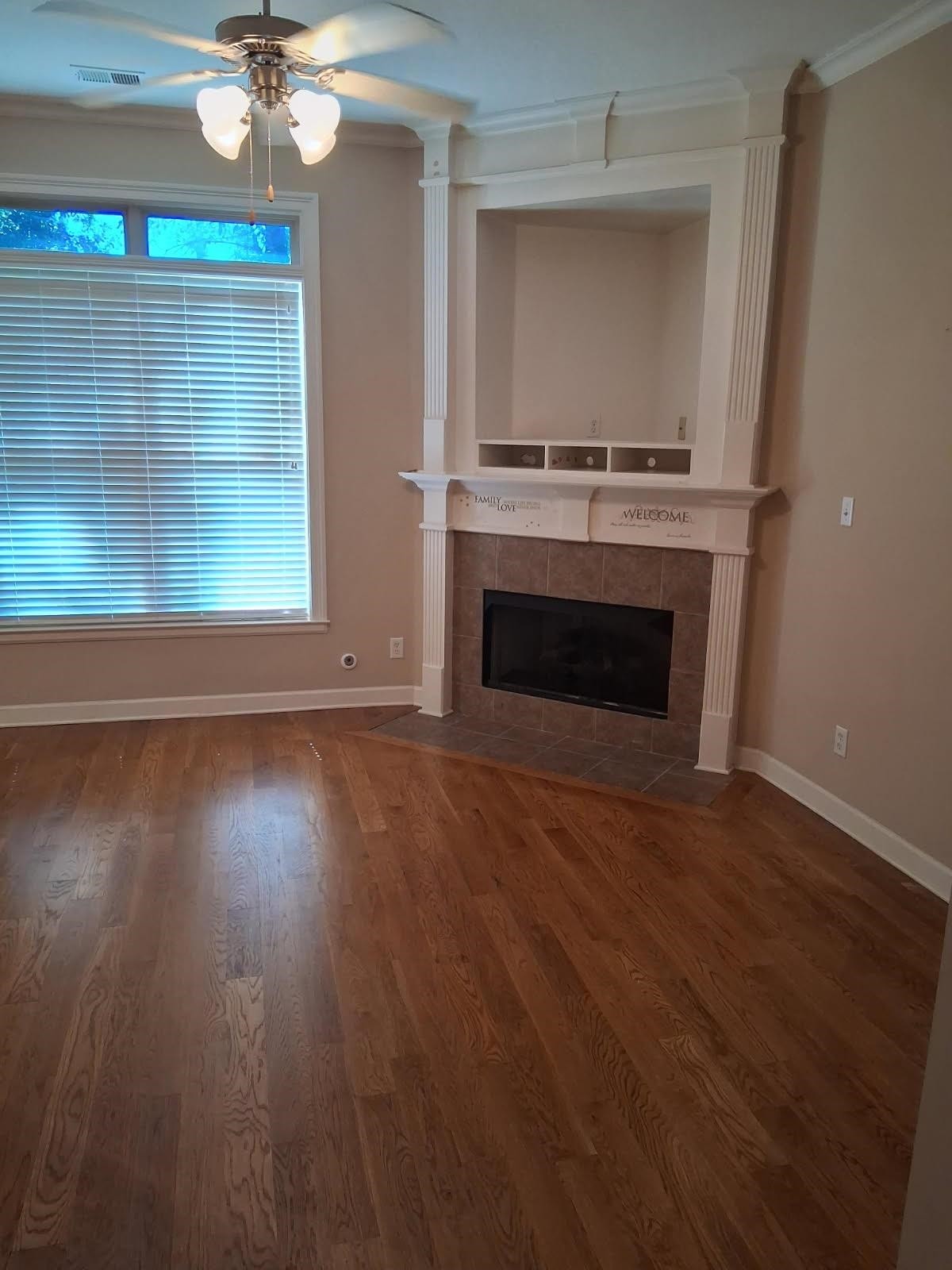 10481 Mabry Mill Road Cordova, TN 38016 - Photo 5 of 32 an empty room with wooden floor a fireplace