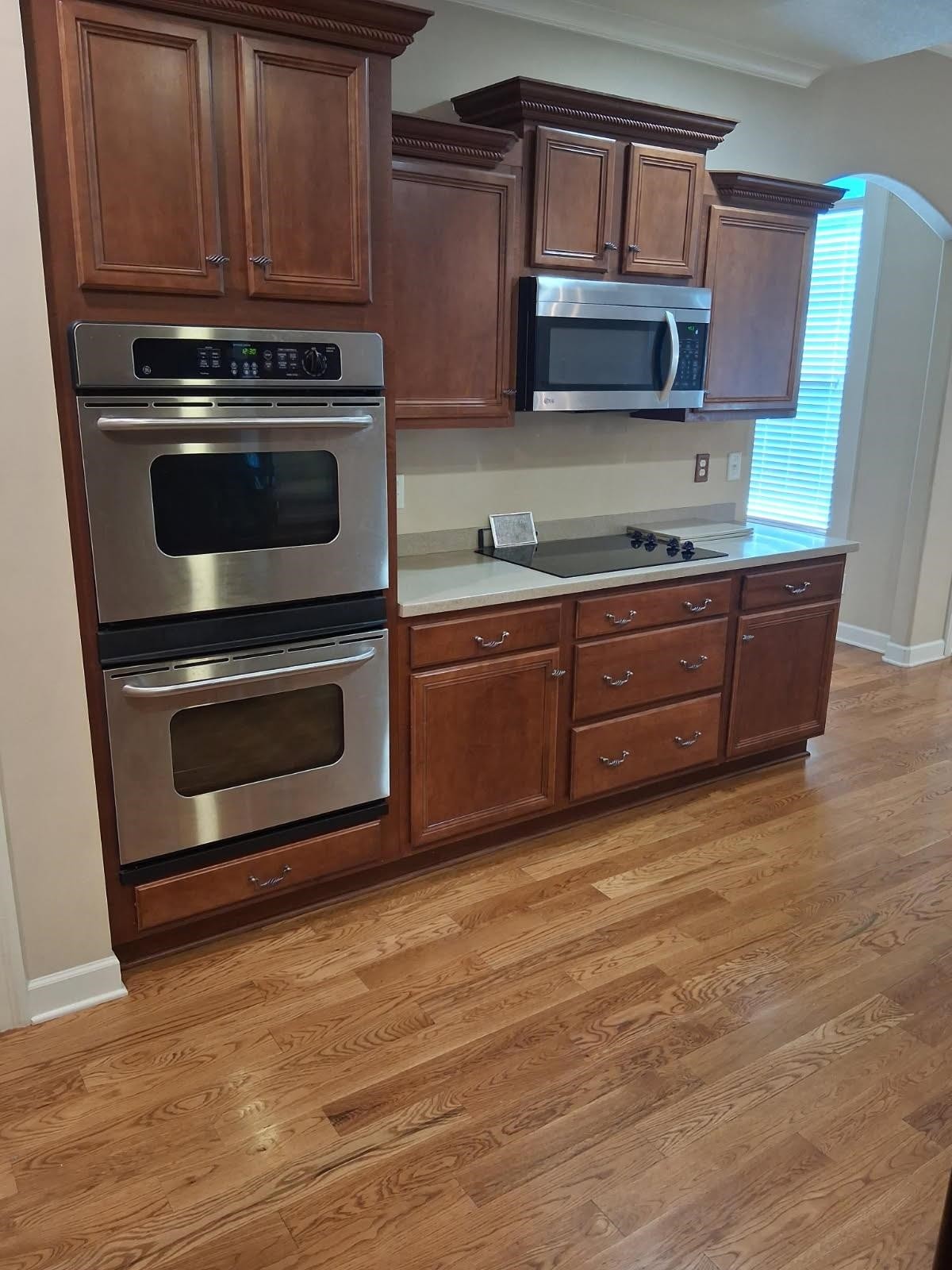 10481 Mabry Mill Road Cordova, TN 38016 - Photo 9 of 32 a kitchen with granite countertop wooden cabinets and stainless steel appliances