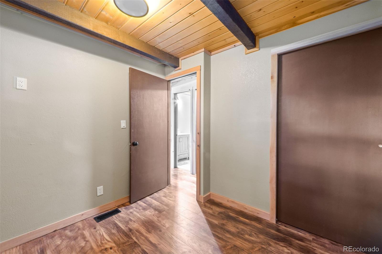 827 Mine Road Idaho Springs, CO 80452 - Photo 16 of 30 a view of a room with wooden floor